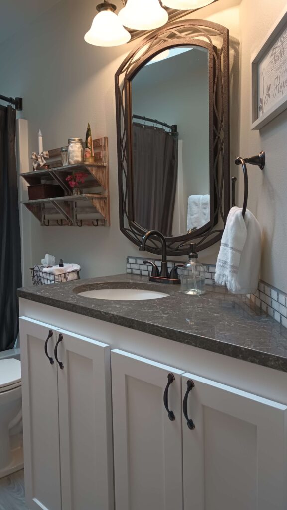 An angular bathroom vanity using Caesarstone Coastal Gray